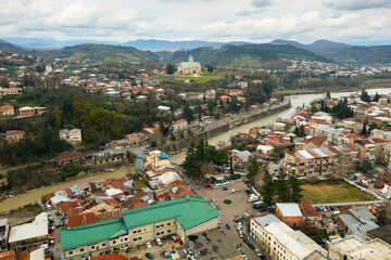 Picturesque aerial view of Georgian town of Kutaisi surrounded by hills
