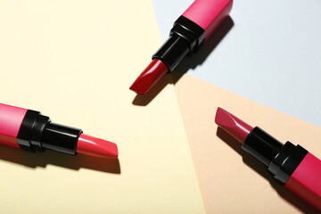 Fototapeta premium Composition with beautiful lipsticks on color background