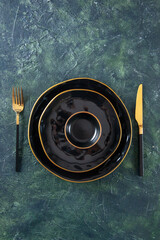top view black plates different sized with knife and fork on a dark background meal meat cuisine shine cutlery kitchen food darkness