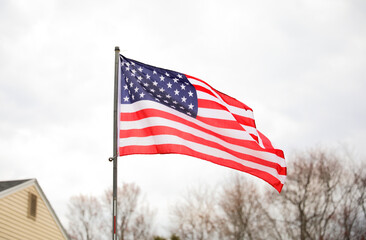 US flag, symbolizing American values of freedom, democracy, and patriotism. Red symbolizes valor...