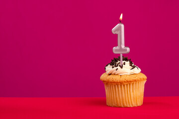 Candle number 1 - Cake birthday in rhodamine red background