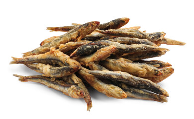 Pile of delicious fried anchovies on white background