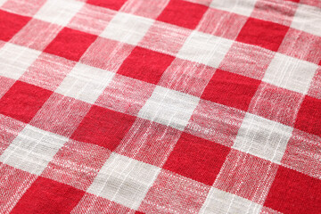 Red checkered tablecloth as background, closeup view