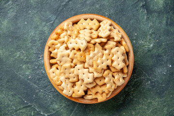 top view little crackers inside plate on dark background crisp color snack salt bread rusk food cips