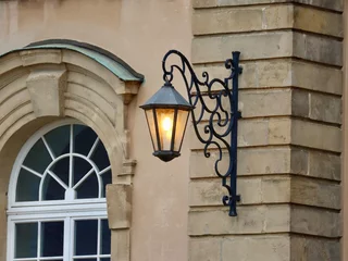 Vlies Fototapete Altes Gebäude Old style street lamp on Echternach Abbey main facade. Luxembourg
