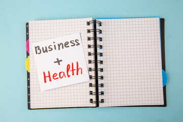 top view open copybook with business health on a blue background color notepad school study student college lesson