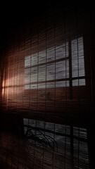 Morning sunlight streams in through the cracks in the windows of the house