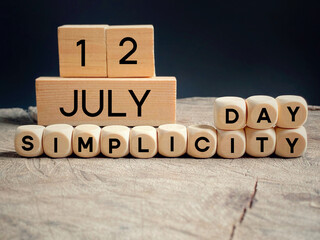 Simplicity day 12 July text on wooden blocks background. A tribute to Henry David Thoreau. National celebration day.
