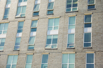 city brick buildings can symbolize urbanization, industrialization, and modernity, representing stability and endurance, while the cityscape suggests a bustling and dynamic environment