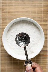 Top view of an empty measuring spoon, one tablespoon measure, silver antique measuring spoon