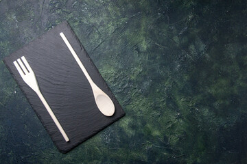 top view plastic utencils with black board on dark background food spoon knife photo plastic dinner kitchen fork cutlery free space - Powered by Adobe
