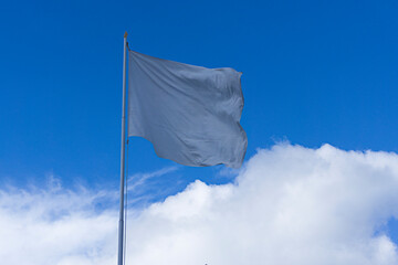 white flag with clouds