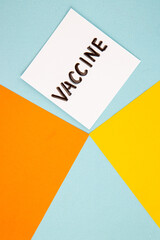 top view vaccine writing on a light blue background color hospital lab virus covid- pandemic science health