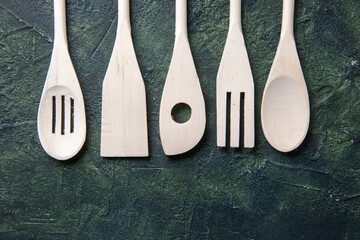 top view white plastic utencils on dark background plastic fork cutlery wood color knife kitchen...