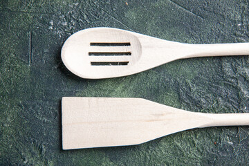 top view white plastic utencils on the dark background plastic fork cutlery wood darkness knife kitchen food photo