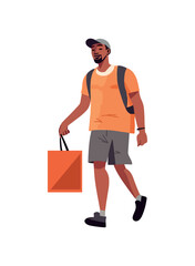 young man walking with bag