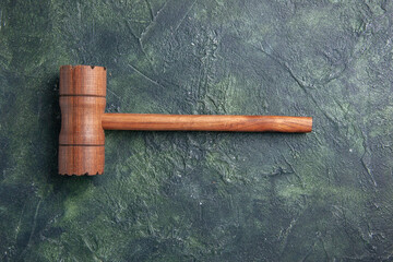 top view wooden hammer for meat beating on dark background kitchen color wood cutting board photo...