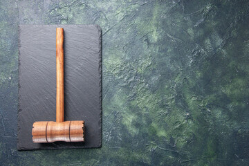 top view wooden hammer on black board on dark background kitchen color wood photo butcher meat cuisine food free space