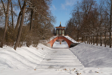 Cross bridge (Krestovy bridge) in the Alexander Park of Tsarskoye Selo on a sunny winter day,...