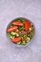 Salad slices of raw vegetables with lentils