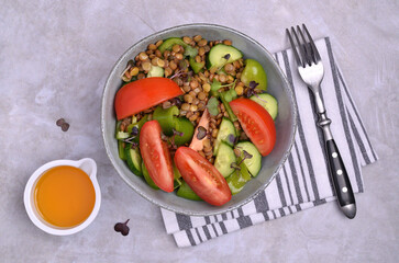 Salad slices of raw vegetables with lentils