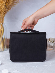 Close up of  black  necessaire bag for miscellaneous use, bathroom, travel, toilet, hotel, school...