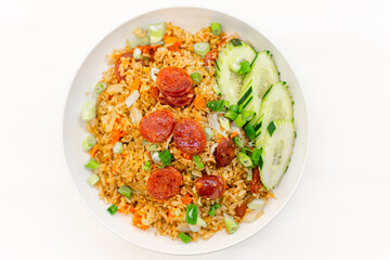 Fried rice with Chinese pork sausage , eggs , scallions and cucumbers on white background.