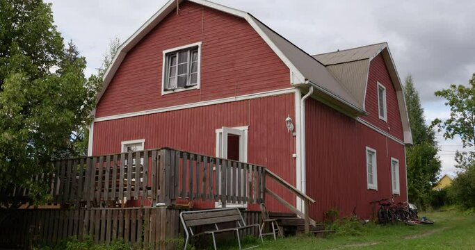 Red wooden farm house on a farm