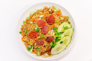 Fried rice with Chinese pork sausage , eggs , scallions and cucumbers on white background.