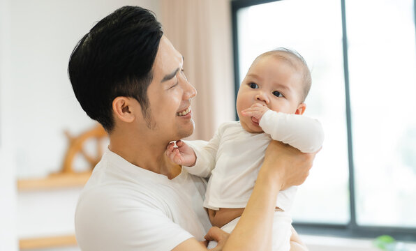 image of asian father and son at home
