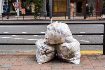 A pile of trash bag on a footpath in Tokyo, Japan
