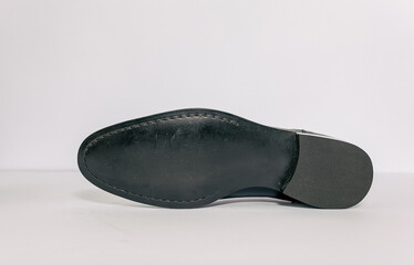 Outsole of formal mens shoes on white background