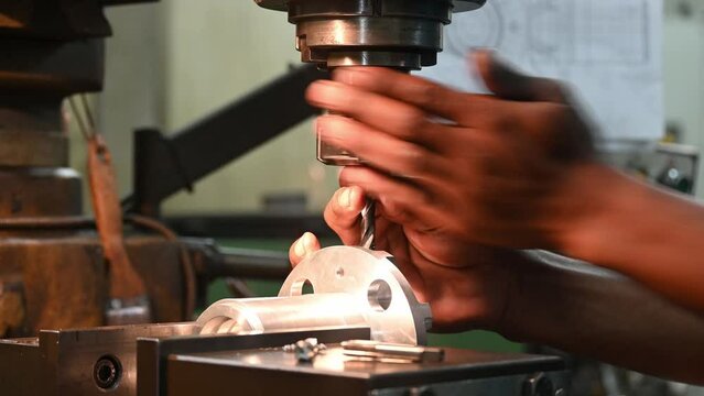 The machine operator change the cutting tool on NC milling machine by skill operator.