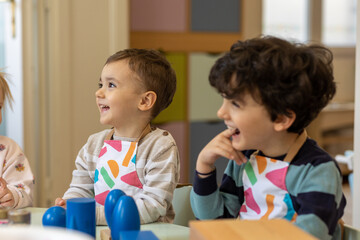 Kids playing in montessori kindergarten - obrazy, fototapety, plakaty