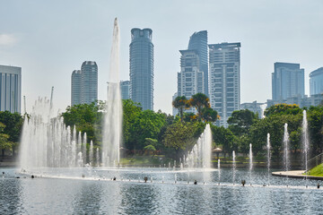 The central park of the city near the Petronas Towers in the daytime. Kuala Lumpur, Malaysia.