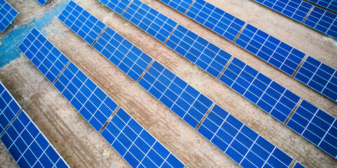 Aerial view of solar panel farm. Solar power station aerial view. Rows of solar photovoltaic...