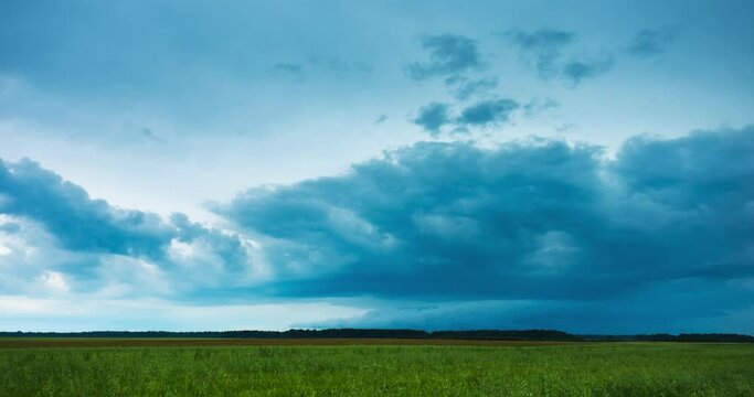A powerfull dangerous spinning supercell storm aproaching. Wall cloud of a supercell. Climate change concept. 