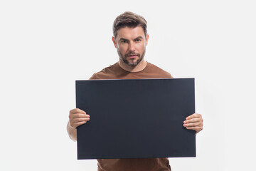 Man with empty blank board on studio background. Blank signboard with copy space. Advertisement concept. Ad board with copy space, blank mock up copy space. Blank signboard, placard with copy space.