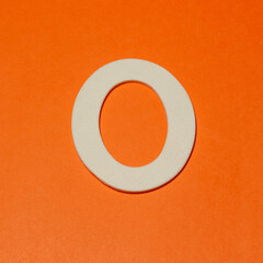 Uppercase letter O - wood texture - Orange background