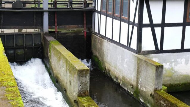 SLUPSK, POLAND Weir of the Castle Mill. Slupia river in Slupsk old water mill. Waterfall in early spring. 