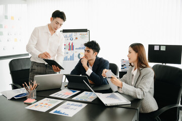 Business team discuss at meeting room. working together with laptop ,tablet and smart phone on desk Financial accountant , planner , meeting , introduction concept.