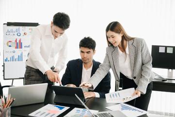 Obraz premium Group of Young Asian business team creative businesspeople coworker, teamwork celebrating achievement and in planning design in creative