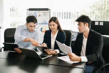 Portrait of success business Asian people working together in office. Couple teamwork startup concept.