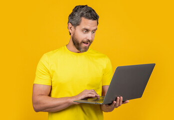 amazed man blogger isolated on yellow. man blogger on background. man blogger in studio.