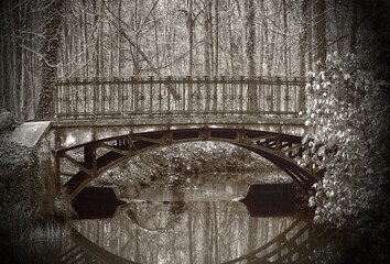 Old bridge in the park.
Vintage photo.