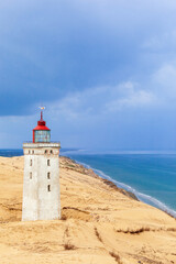 Fototapeta na wymiar Rubjerg knude lighthouse on a sand dune