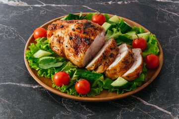 grilled chicken roll. Fresh vegetables on a plate