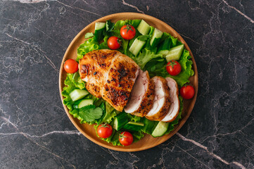 grilled chicken roll. Fresh vegetables on a plate