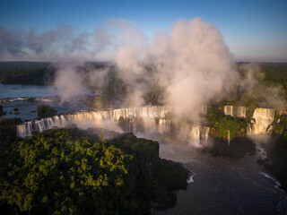 Fototapeta na wymiar Beautiful view to Iguazu Falls waterfalls with green rainforest 