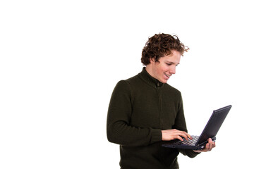 A young attractive man is working on a laptop. Early morning. White background.